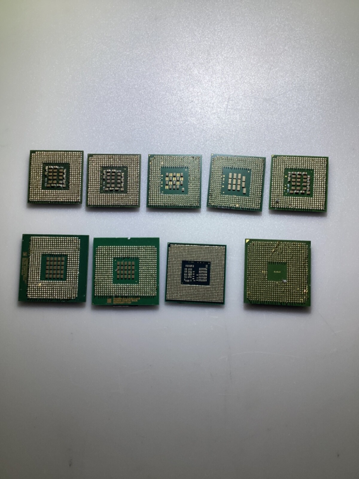 LOT OF NINE ASSORTED CPU PROCESSOR CHIPS INTEL, AMD, PREOWNED, CONDITION UNKNOWN